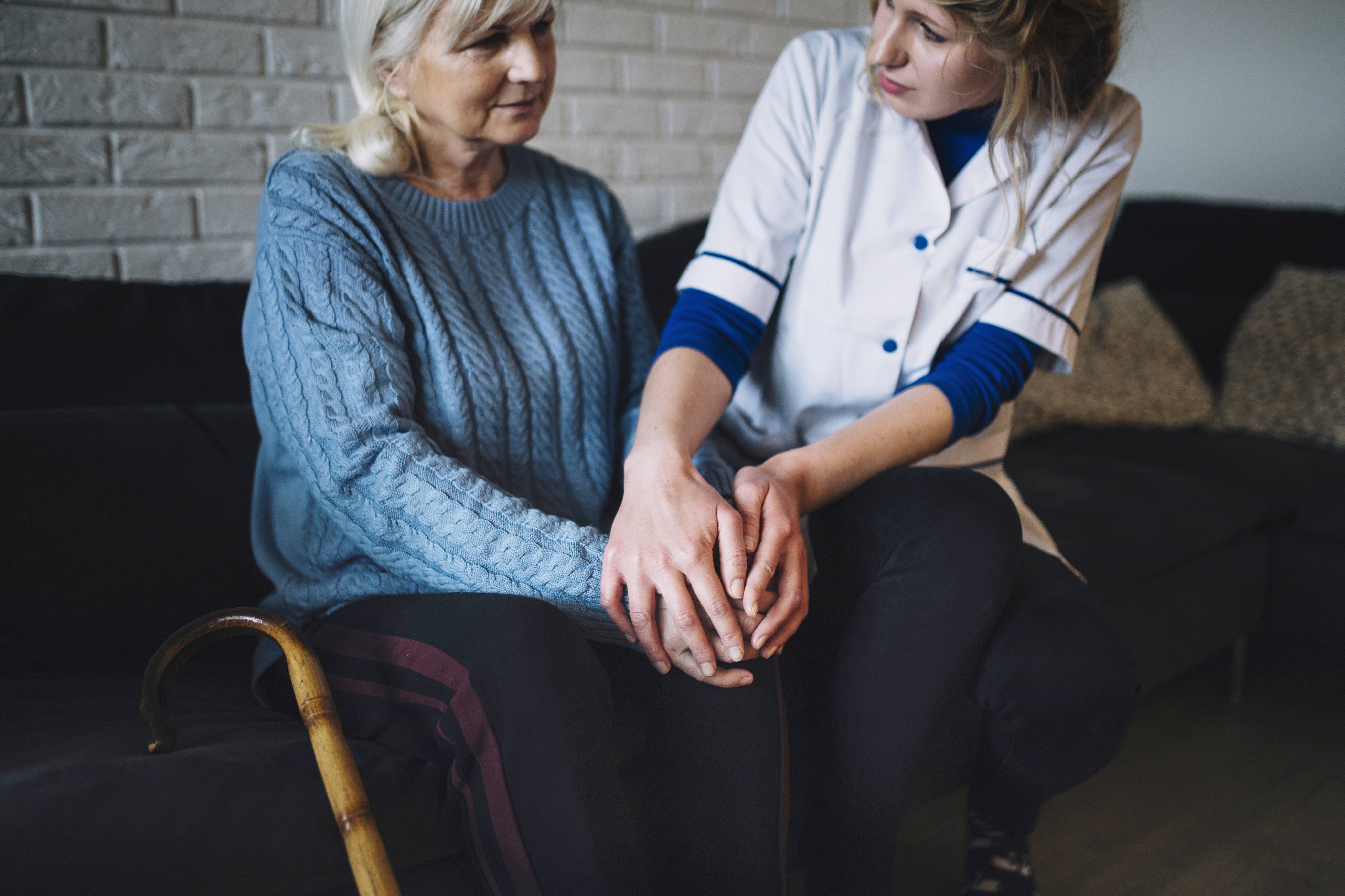 Caregiver supporting an older adult at home